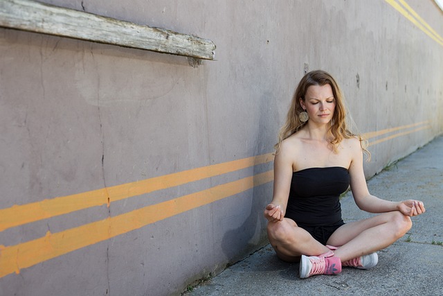 person meditating in peaceful natural setting with soft morning light